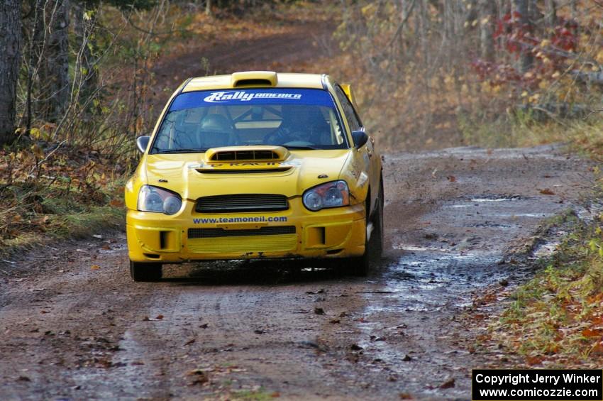 Tim O'Neil / Martin Headland head uphill to the finish of SS8, Gratiot Lake 1, in their Subaru WRX STi.