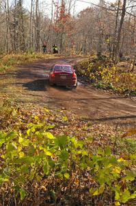 Dennis Martin / Alex Kihurani drift through the final corner of Gratiot Lake 1, SS8, in their Mitsubishi Lancer Evo IV.