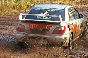 Robert Borowicz / Mariusz Borowicz slosh mud at the final corner of SS8, Gratiot Lake 1, in their their Subaru WRX STi.