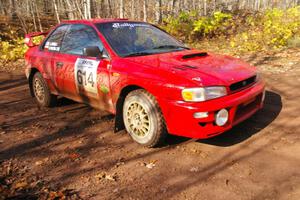 Piotr Wiktorczyk / John Nordlie	set up for the final corner of SS8, Gratiot Lake 1, in their Subaru Impreza.