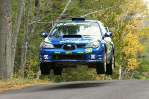 Travis Pastrana / Christian Edstrom catch nice air at the midpoint jump on Brockway 1, SS11, in their Subaru WRX STi.