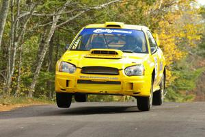 Tim O'Neil / Martin Headland at the midpoint jump on Brockway 1, SS11, in their Subaru WRX STi.