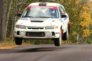 Chris Gilligan / Joe Petersen Mitsubishi Lancer Evo IV at the midpoint jump on Brockway 1, SS11.