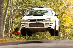 Henry Krolikowski / Cindy Krolikowski get nice air at the midpoint jump on Brockway 1, SS11, in their Subaru WRX.