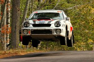 Robert Borowicz / Mariusz Borowicz catch nice air at the midpoint jump on Brockway 1, SS11, in their Subaru WRX STi.