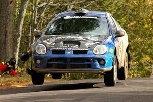 Cary Kendall / Scott Friberg catch minor air over the midpoint jump on Brockway 1 in their Dodge SRT-4.