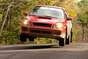 Bryan Pepp / Jerry Stang Subaru WRX at the midpoint jump on Brockway 1, SS11.