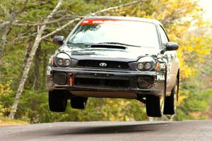 Pat Moro / Mike Rossey catch nice air at the Brockway 1 midpoint jump, SS11, in their Subaru WRX.