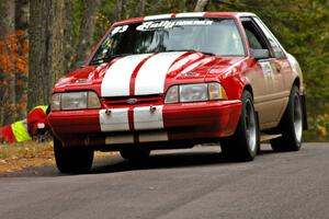 Mark Utecht / Rob Bohn take it easy over the midpoint jump on Brockway 1, SS11, in their Ford Mustang.