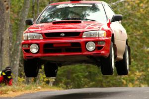 Piotr Wiktorczyk / John Nordlie	had the biggest air at the midpoint jump on Brockway 1, SS11, in their Subaru Impreza.