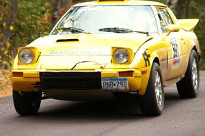 Dave Cizmas / Matt Himes take it easy over the midpoint jump on Brockway 1, SS11, in their Mazda RX-7.