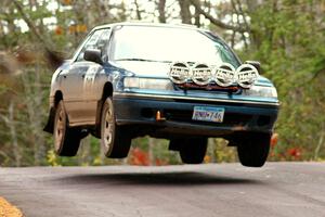 Erick Murray / Nicky Nelson catch nice air over the midpoint jump on Brockway 1, SS11, in their Subaru Legacy.