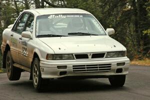 Larry Parker / Mandi Gentry catch a little air at the midpoint jump on Brockway 1, SS11, in their Mitsubishi Galant VR4.