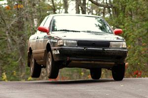 Brian Dondlinger / Dave Parps catch mild air at the midpoint jump on Brockway 1, SS11, in their Nissan Sentra SE-R.