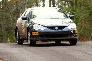 Eric Heitkamp / Nick Lehner keep it to the pavement over the midpoint jump on Brockway 1, SS11, in their Acura RSX.