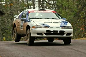 Paul Ritchie / Drew Ritchie catch minor air over the midpoint jump on Brockway 1, SS11, in their Mitsubishi Eclipse GSX.