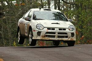 Paul Dunn / Bill Westrick catch minor air over the midpoint jump on Brockway 1, SS11, in their Dodge SRT-4.