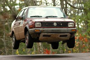 Matt Bushore / Andy Bushore catch nice air at the midpoint jump on Brockway 1, SS11, in their VW Jetta.