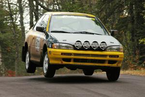 Jaroslaw Sozanski / Kazimierz Pudelek catch a little air at the midpoint jump on Brockway 1, SS11, in their Subaru Impreza.