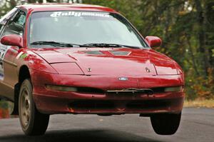 Tom Diehl / Mike Rodriquez catch decent air over the midpoint jump on Brockway 1, SS11, in their Ford Probe GT.