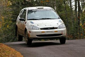 Mike Gagnon / Bob Martin get the back end light at the midpoint jump on Brockway 1, SS11, in their Ford Focus ZX3.
