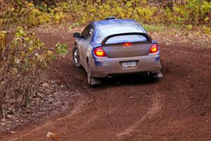 Cary Kendall / Scott Friberg drift through the first corner of SS15, Gratiot Lake 2, in their Dodge SRT-4.