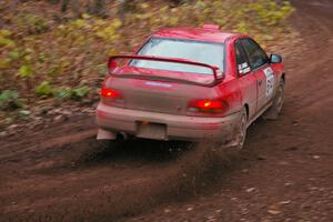 Piotr Wiktorczyk / John Nordlie throw gravel at first corner of SS15, Gratiot Lake 2, in their Subaru Impreza.