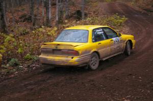 Erik Payeur / Adam Payeur through the first corner of Gratiot Lake 1, SS15, in their Mitsubishi Galant.