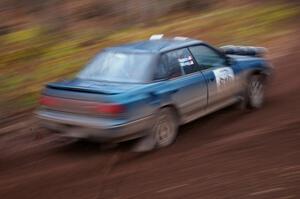 Erick Murray / Nicole Nelson drift through the first corner of SS15, Gratiot Lake 2, in their Subaru Legacy.