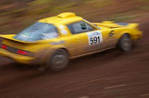 Dave Cizmas / Matt Himes at speed through the first corner of Gratiot Lake 2, SS15, in their Mazda RX-7.