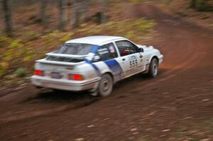 Colin McCleery / Nancy McCleery	exit the first corner of Gratiot Lake 2, SS15, in their Merkur XR-8.