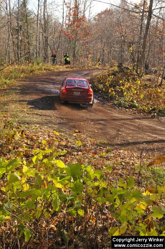 Dennis Martin / Alex Kihurani drift through the final corner of Gratiot Lake 1, SS8, in their Mitsubishi Lancer Evo IV.