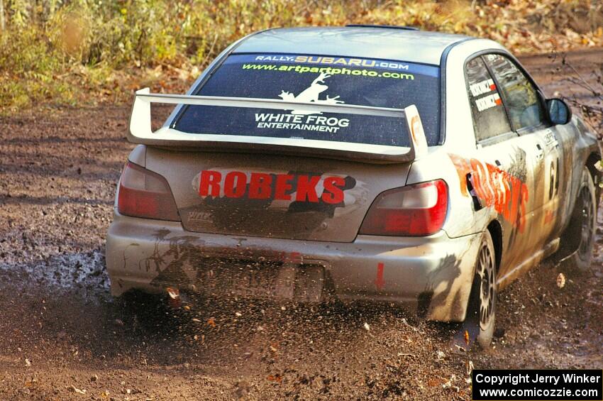 Robert Borowicz / Mariusz Borowicz slosh mud at the final corner of SS8, Gratiot Lake 1, in their their Subaru WRX STi.