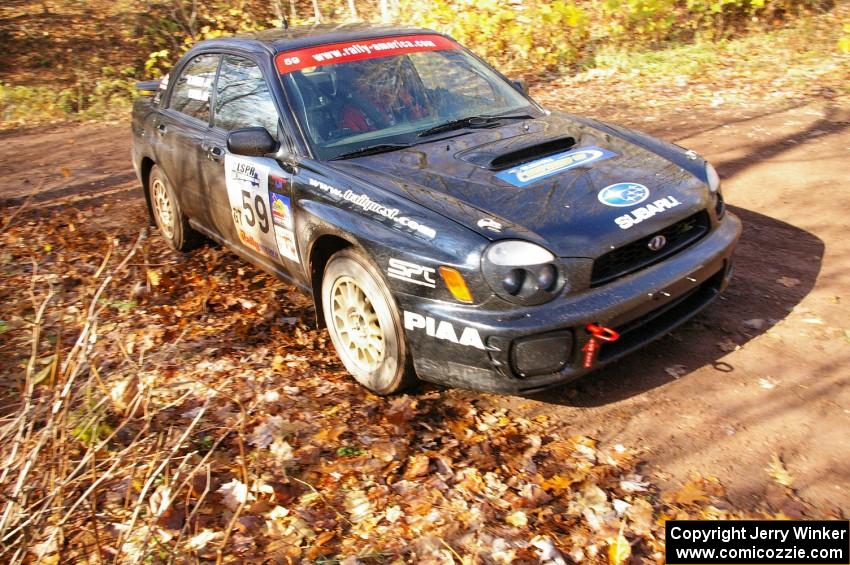 Pat Moro / Mike Rossey at speed at the final corner of SS8, Gratiot Lake 1, in their Subaru WRX.