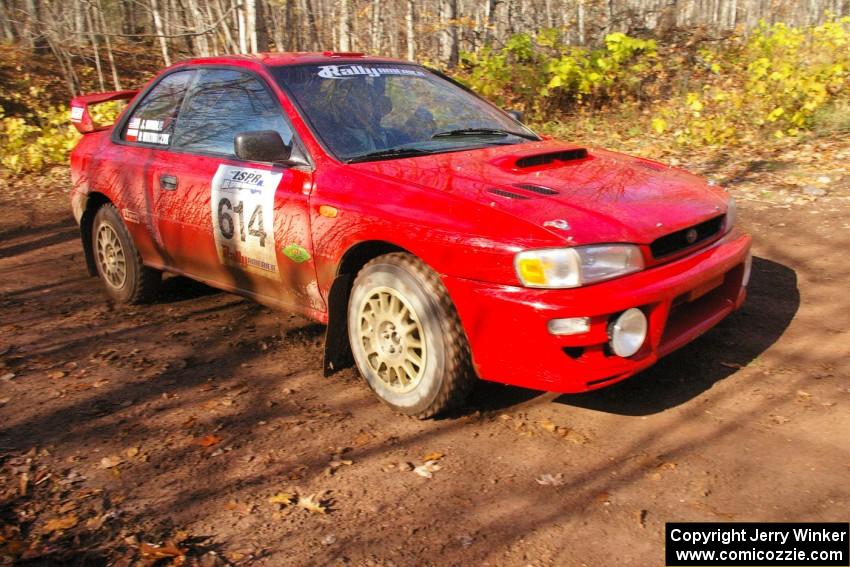 Piotr Wiktorczyk / John Nordlie	set up for the final corner of SS8, Gratiot Lake 1, in their Subaru Impreza.