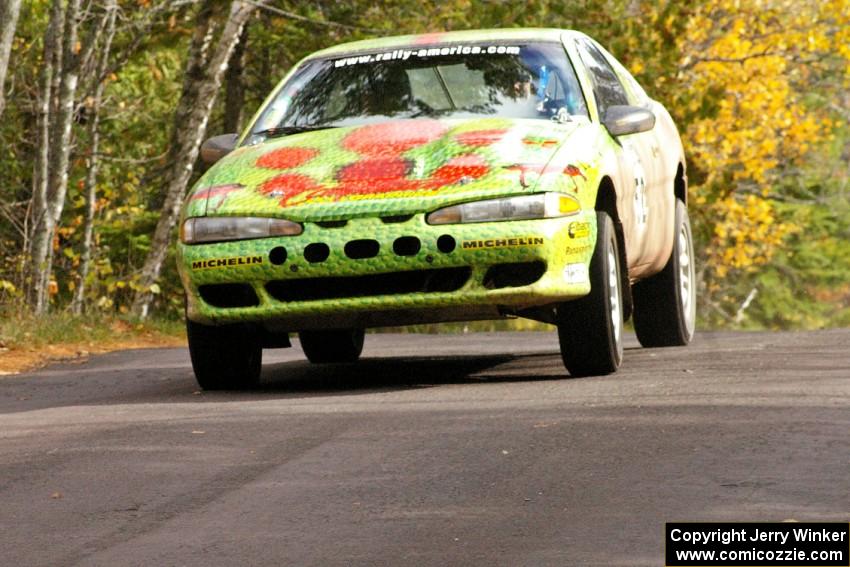 Doug Shepherd / Pete Gladysz keep their Mitsubishi Eclipse glued to the ground at the midpoint jump on Brockway 1, SS11.