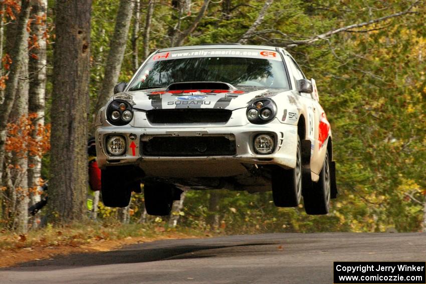 Robert Borowicz / Mariusz Borowicz catch nice air at the midpoint jump on Brockway 1, SS11, in their Subaru WRX STi.