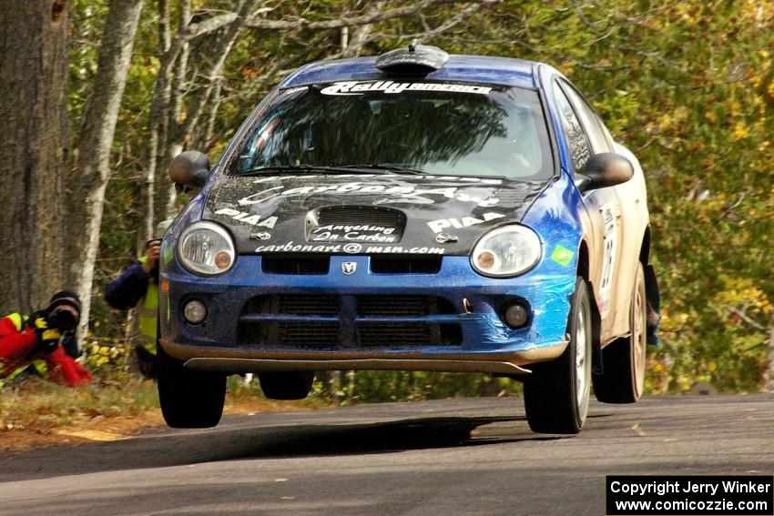 Cary Kendall / Scott Friberg catch minor air over the midpoint jump on Brockway 1 in their Dodge SRT-4.