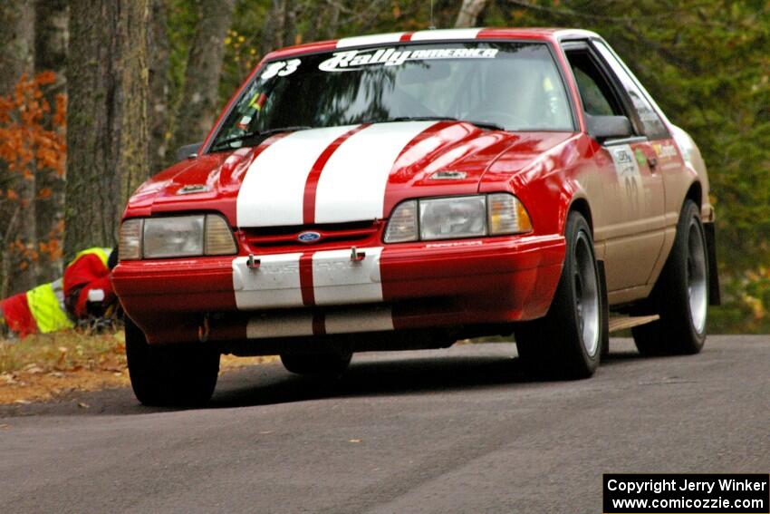 Mark Utecht / Rob Bohn take it easy over the midpoint jump on Brockway 1, SS11, in their Ford Mustang.