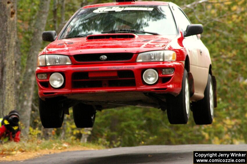Piotr Wiktorczyk / John Nordlie	had the biggest air at the midpoint jump on Brockway 1, SS11, in their Subaru Impreza.