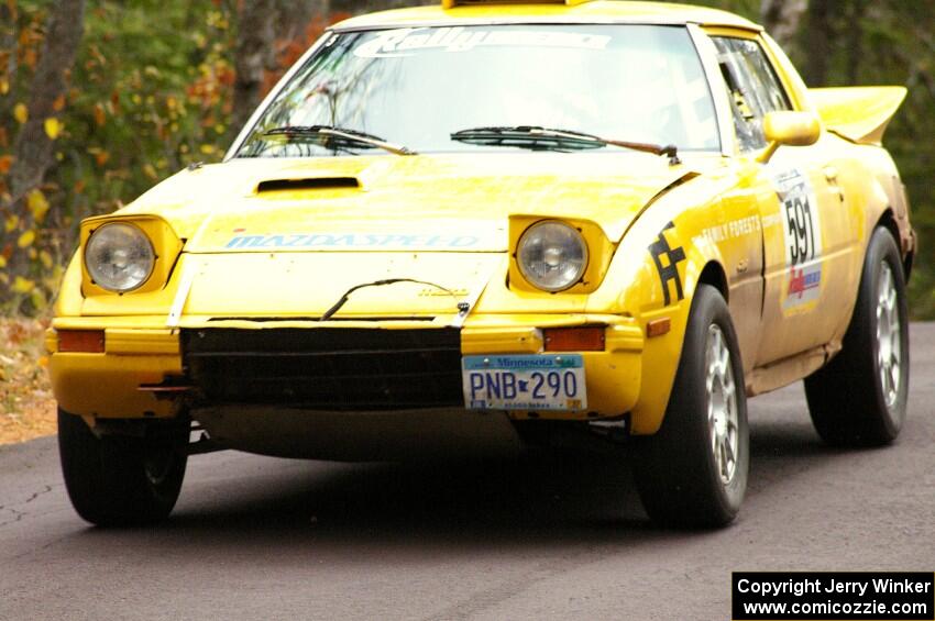 Dave Cizmas / Matt Himes take it easy over the midpoint jump on Brockway 1, SS11, in their Mazda RX-7.