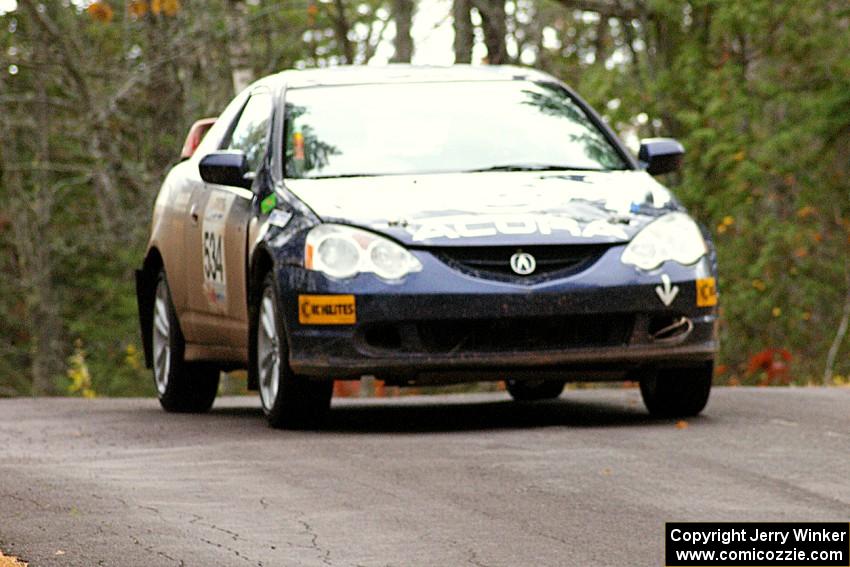 Eric Heitkamp / Nick Lehner keep it to the pavement over the midpoint jump on Brockway 1, SS11, in their Acura RSX.