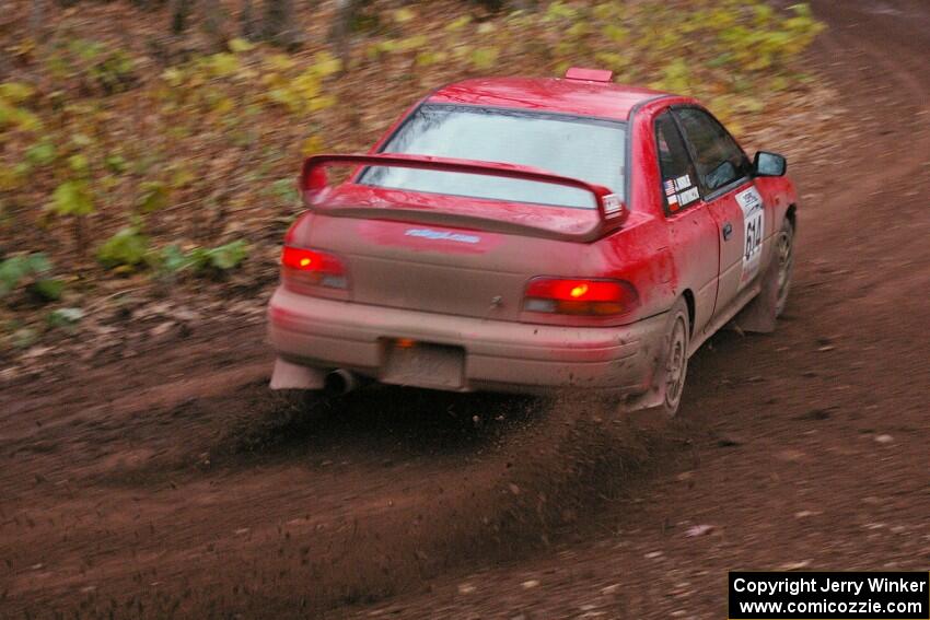 Piotr Wiktorczyk / John Nordlie throw gravel at first corner of SS15, Gratiot Lake 2, in their Subaru Impreza.