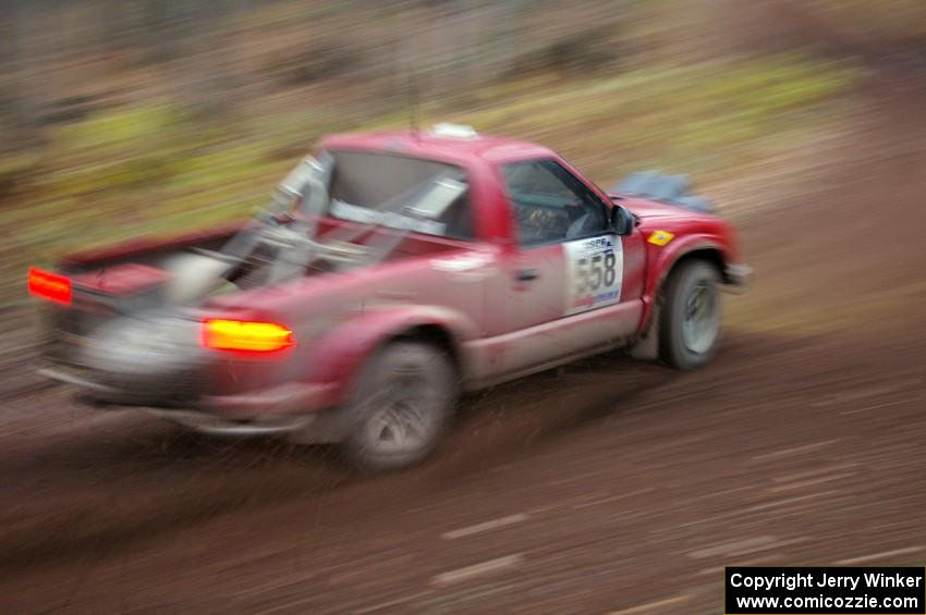 Jim Cox / Scott Parrott get back on the power in their Chevy S-10 at the first corner of Gratiot Lake 2, SS15.