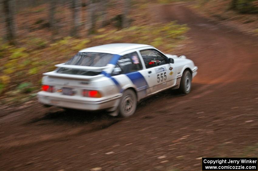 Colin McCleery / Nancy McCleery	exit the first corner of Gratiot Lake 2, SS15, in their Merkur XR-8.